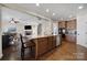 Kitchen with granite countertops, stainless steel appliances and open view to the living room and fireplace at 2517 Trading Ford Dr, Waxhaw, NC 28173