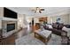 Living room with hardwood floors, fireplace, and open floor plan at 2517 Trading Ford Dr, Waxhaw, NC 28173