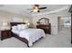 This primary bedroom features tray ceilings, a ceiling fan, and a sitting area at 2517 Trading Ford Dr, Waxhaw, NC 28173