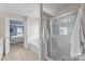 Bright bathroom with walk-in shower, soaking tub, vanity with sink, and tile floors at 252 Legend Dr, Rock Hill, SC 29732