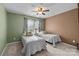 Cozy bedroom featuring twin beds, complemented by soft lighting, curtains and decorative pillows at 252 Legend Dr, Rock Hill, SC 29732