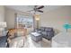 Comfortable bedroom with a large window, a foosball table, and a cozy gray loveseat at 252 Legend Dr, Rock Hill, SC 29732