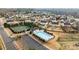Aerial view of a sparkling community pool with tennis courts and manicured landscaping at 252 Legend Dr, Rock Hill, SC 29732