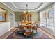 Sunlit dining area with elegant decor, including a chandelier and decorative china cabinet at 252 Legend Dr, Rock Hill, SC 29732
