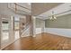 Open-concept featuring hardwood floors, decorative trim, and an elegant chandelier at 252 Legend Dr, Rock Hill, SC 29732
