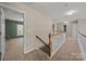 Upstairs hallway with white railings, carpet, and views into rooms at 252 Legend Dr, Rock Hill, SC 29732