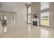 Open living room with tile flooring, a fireplace, and abundant natural light at 252 Legend Dr, Rock Hill, SC 29732