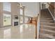 Spacious living room with high ceilings, gas fireplace, and stairs leading to upper level at 252 Legend Dr, Rock Hill, SC 29732