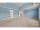 Spacious primary bedroom with blue vaulted ceilings and neutral carpeting at 252 Legend Dr, Rock Hill, SC 29732