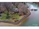 Beautiful aerial view of the house on the lakefront showing waterfront access and lush landscaping at 2818 Cherry Ln, Denver, NC 28037