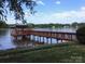 Picturesque waterfront dock and lake view, perfect for enjoying outdoor recreation and relaxation at 2818 Cherry Ln, Denver, NC 28037