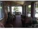 Cozy screened porch with wicker furniture, perfect for enjoying the outdoors in comfort and style at 2818 Cherry Ln, Denver, NC 28037