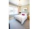 Bright bedroom featuring a brass bed frame, soft natural light, and neutral decor for relaxation at 305 Old Town Village Rd, Waxhaw, NC 28173