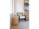 Cozy bedroom corner with a comfortable chair, stylish dresser, and a decorative flower vase at 305 Old Town Village Rd, Waxhaw, NC 28173