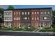 Row of new townhomes features a mix of brick and siding, lush lawns, and convenient street access at 305 Old Town Village Rd, Waxhaw, NC 28173