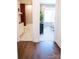 Hallway reveals a bathroom with black and white tile and a bedroom with large windows and natural light at 305 Old Town Village Rd, Waxhaw, NC 28173
