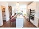 Open kitchen with a large island, stainless steel appliances, and seamlessly connects to the living area at 305 Old Town Village Rd, Waxhaw, NC 28173