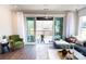 Living room with outdoor access, hardwood floors, stylish furniture, and great natural light at 305 Old Town Village Rd, Waxhaw, NC 28173