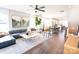 Bright open-concept living room features modern decor, stylish furniture, and seamless flow to the kitchen and dining area at 305 Old Town Village Rd, Waxhaw, NC 28173