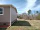 Wide open backyard on a lot with trees, offering plenty of space and privacy at 404 B And S Ln, Hickory, NC 28601