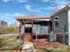 Back porch featuring privacy fence, stairs and easy access to air conditioning unit at 404 B And S Ln, Hickory, NC 28601