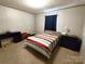 This bedroom includes carpet floors, a full sized bed, and dresser at 404 B And S Ln, Hickory, NC 28601