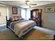 Traditional bedroom with a ceiling fan and dresser with mirror at 404 B And S Ln, Hickory, NC 28601