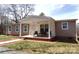Single story home featuring a covered porch, an outdoor ceiling fan and chairs at 404 B And S Ln, Hickory, NC 28601
