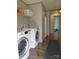 Laundry room with modern appliances and built-in shelving and storage at 404 B And S Ln, Hickory, NC 28601