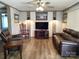 Comfortable living room with modern lighting, wood floors, and stylish furnishings at 404 B And S Ln, Hickory, NC 28601