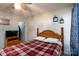 Comfortable bedroom featuring a bed, ceiling fan, and closet access, offers a functional space at 4213 Devonbridge Ln, Charlotte, NC 28269
