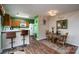 Dining area adjacent to the kitchen features a table and chairs, and access to the backyard through a sliding door at 4213 Devonbridge Ln, Charlotte, NC 28269