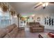 Inviting living room showcasing sofas, an open layout, and easy access to the adjacent dining area at 4213 Devonbridge Ln, Charlotte, NC 28269