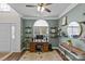 Stylish home office with elegant green walls, ample shelving, and a bright window for a productive workspace at 4741 Lauren Glen Nw St, Concord, NC 28027