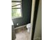 Bathroom with a toilet, sink, and a window at 504 Elizabeth Dr, Gastonia, NC 28052