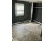 A bedroom featuring gray walls, a window with blinds, and a built-in closet at 504 Elizabeth Dr, Gastonia, NC 28052