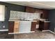 A kitchen with dark brown and light gray cabinets under white countertops at 504 Elizabeth Dr, Gastonia, NC 28052
