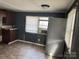 A kitchen featuring a stainless steel refrigerator and dark cabinets at 504 Elizabeth Dr, Gastonia, NC 28052
