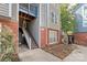 Exterior view of the apartment complex featuring well-maintained landscaping, brick accents, and outdoor stairs at 525 N Graham St # 2F, Charlotte, NC 28202