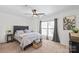 Comfortable bedroom features a ceiling fan and generous natural light at 525 N Graham St # 2F, Charlotte, NC 28202