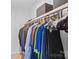 Well organized closet with hanging clothes and storage boxes at 525 N Graham St # 2F, Charlotte, NC 28202