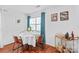 Dining space bathed in natural light with a bar cart at 525 N Graham St # 2F, Charlotte, NC 28202