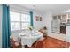 The dining area is bright with natural light and set for an elegant meal at 525 N Graham St # 2F, Charlotte, NC 28202