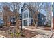 A condo exterior with multiple stories and a fenced-in walkway at 525 N Graham St # 2F, Charlotte, NC 28202