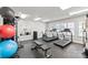 Well-equipped fitness center with treadmills, stationary bike, weights, and exercise balls for a complete workout at 525 N Graham St # 2F, Charlotte, NC 28202