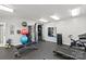 Well-equipped gym featuring weights, exercise equipment, and mirrors at 525 N Graham St # 2F, Charlotte, NC 28202