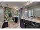 Stylish bathroom with double sinks, dark cabinets, and botanical wallpaper at 5431 Meadowcroft Way, Fort Mill, SC 29708