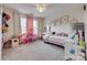 Bright bedroom with pink accent pieces and ample storage at 5431 Meadowcroft Way, Fort Mill, SC 29708