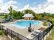 Aerial shot of the community pool with lounge seating, a pavilion, and mature trees providing shade at 5431 Meadowcroft Way, Fort Mill, SC 29708