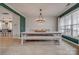 Stylish dining room features a modern light fixture, large windows, and decorative wall trim at 5431 Meadowcroft Way, Fort Mill, SC 29708